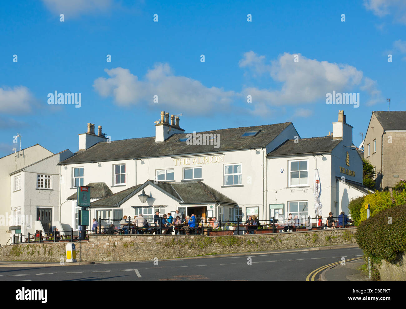 People drinking outside the Albion pub in Arnside, South Lakeland, Cumbria, England UK Stock Photo