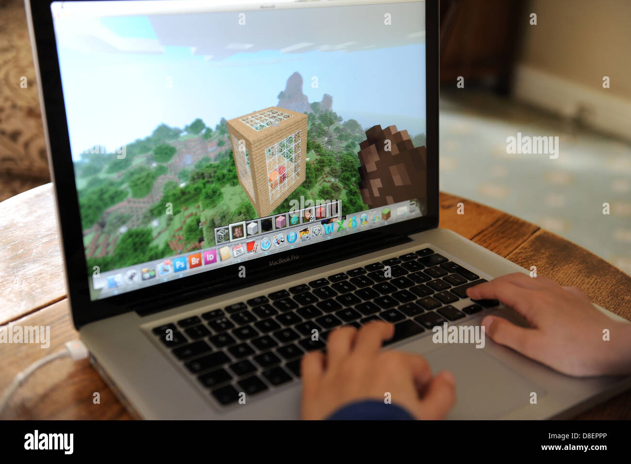 An 8 Year Old Boy Playing Minecraft On His Computer Apple Ipad In His Bedroom At Home Stock Photo Alamy