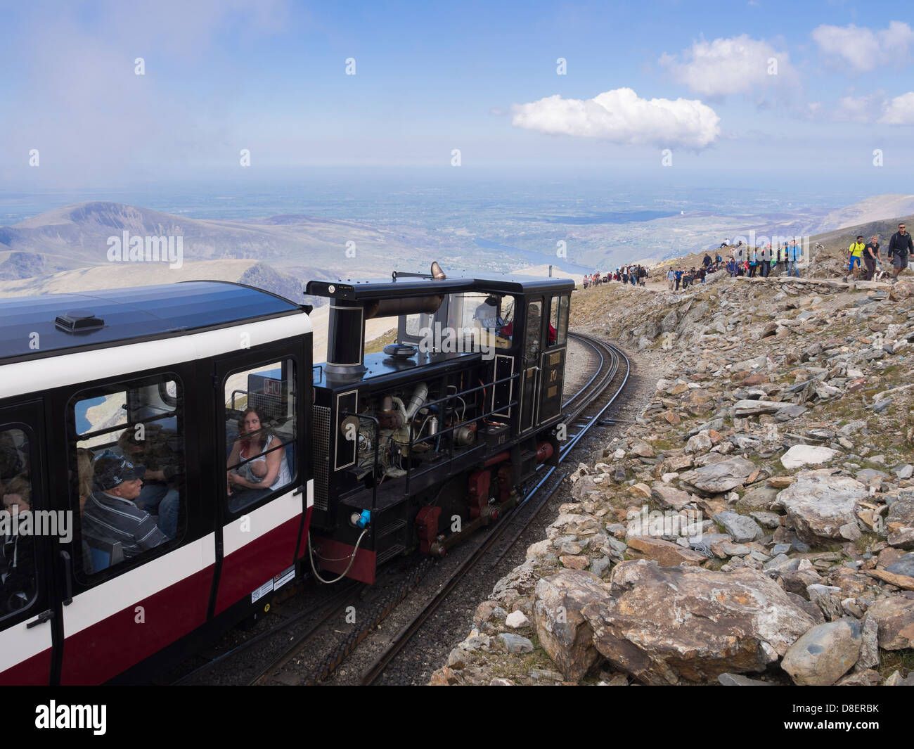 Mt Snowdon mountain railway steam train Yeti packed with tourists leaving summit station for Llanberis Snowdonia North Wales UK Stock Photo
