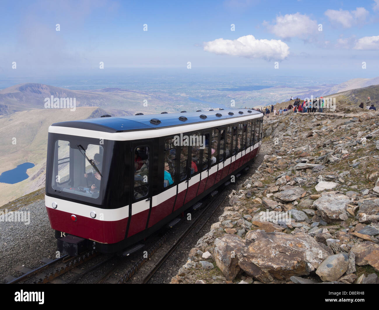 Mt Snowdon mountain railway train with a carriage packed with tourists leaving summit station for Llanberis. Snowdonia Wales UK Stock Photo