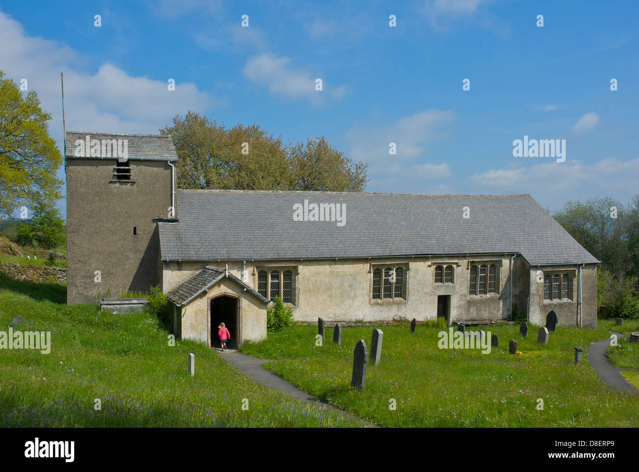 Young girl running inside St Anthony's Church at Cartmel Fell, South Lakeland, Lake District National Park, Cumbria, England UK Stock Photo