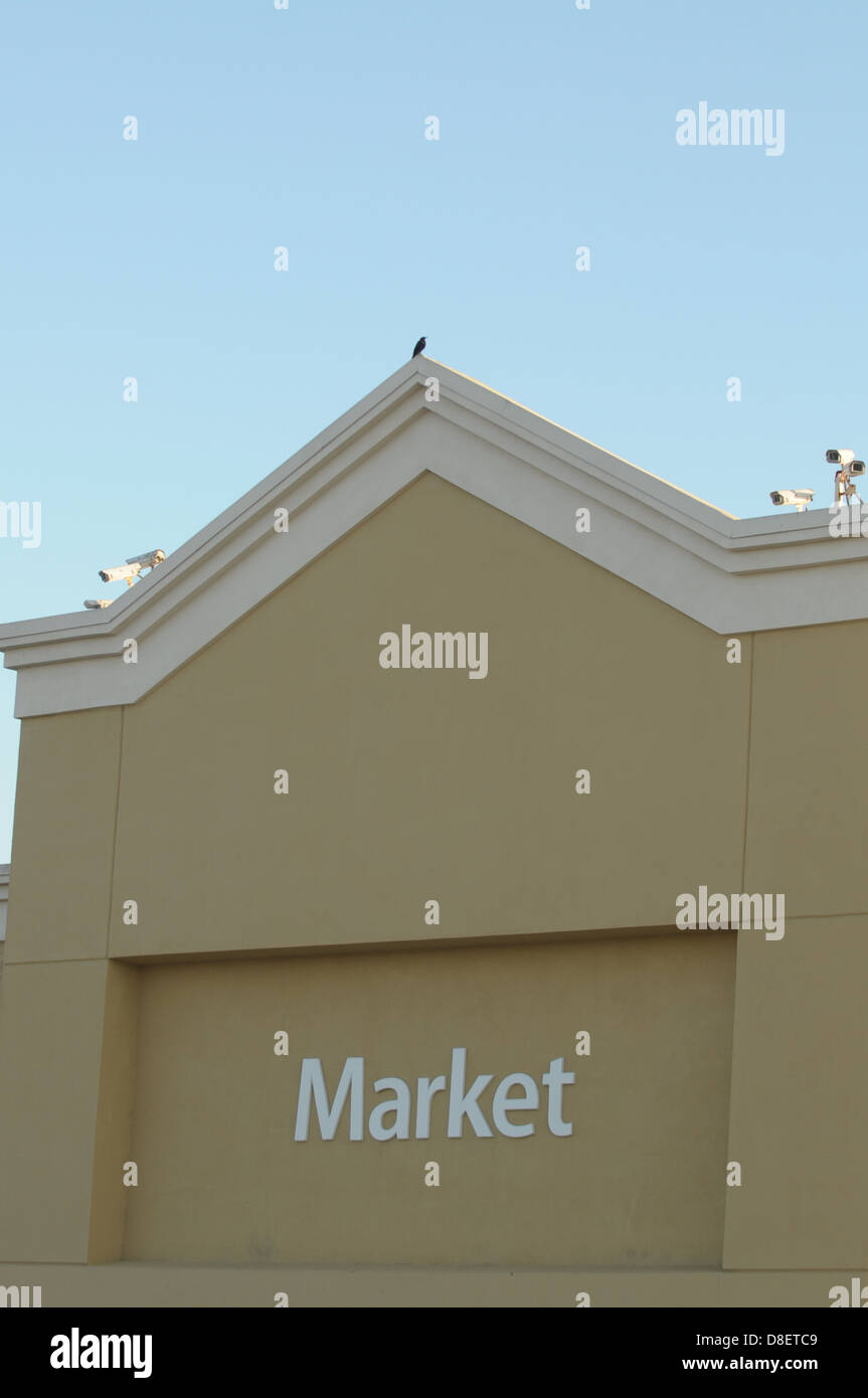Security cameras scan the surroundings above from a Walmart Store in