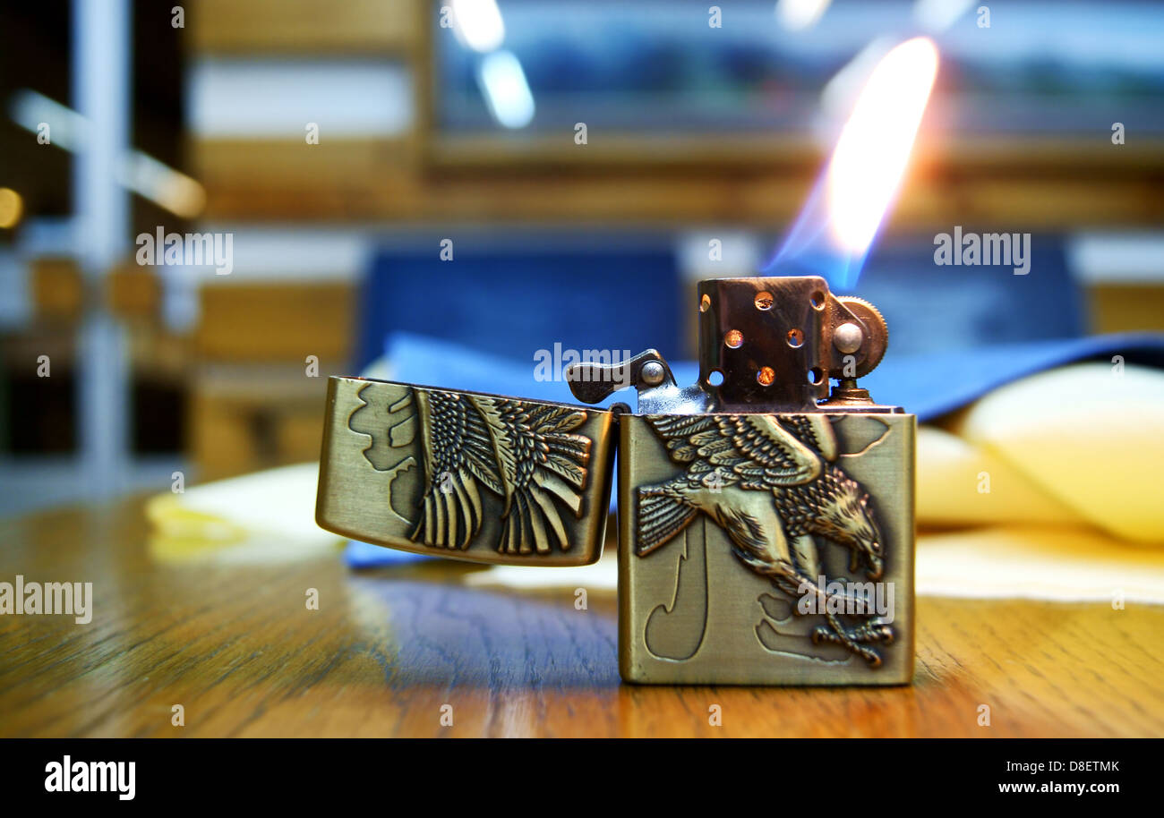 A cigarette lighter with a flame Stock Photo