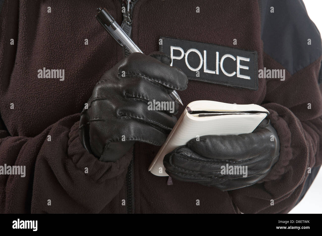 Police notebook and pen being used by a woman officer to take a ...