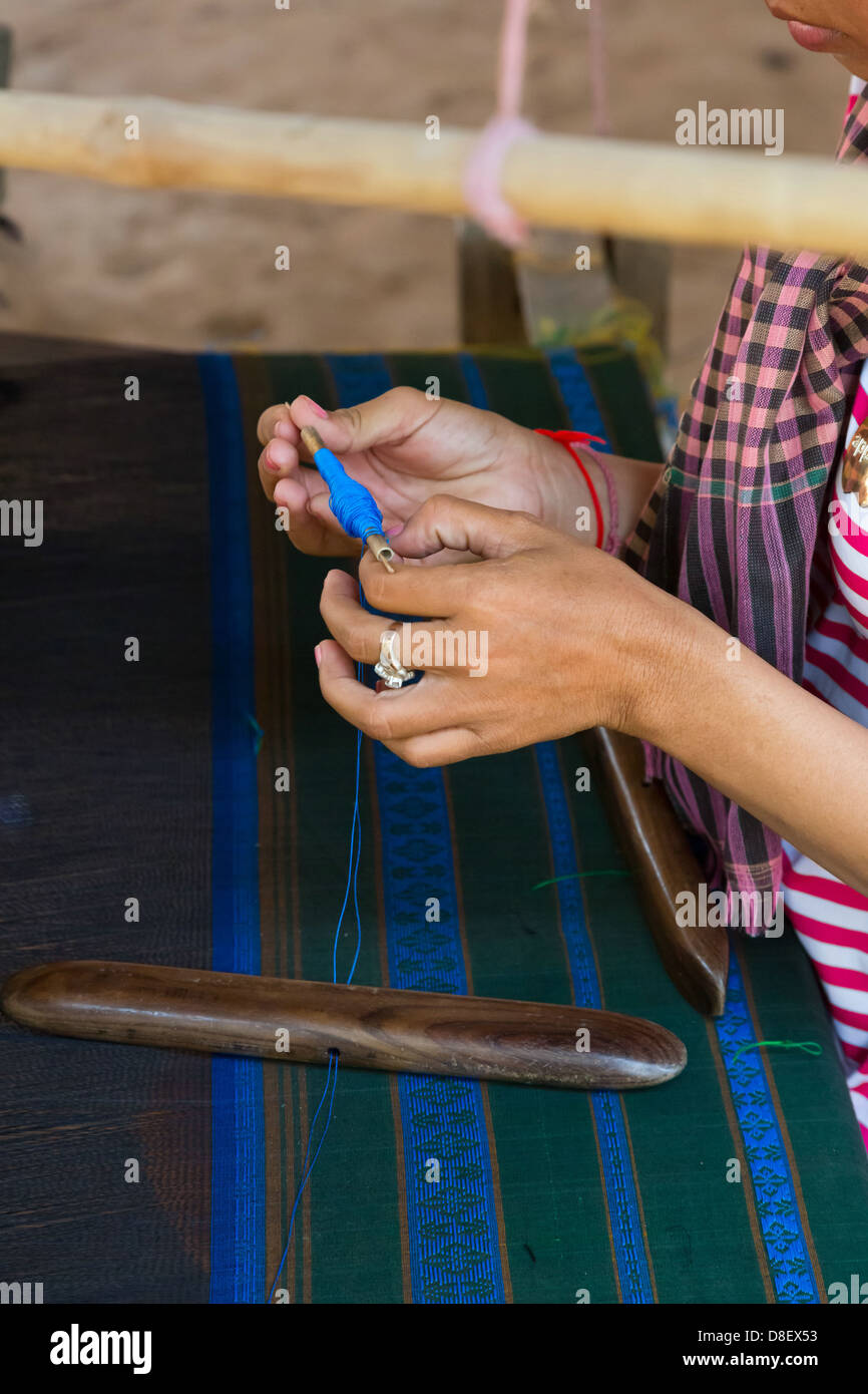 CloseUp of a Woman's Hands weaving Silk on Silk Island (Koh Dach) in