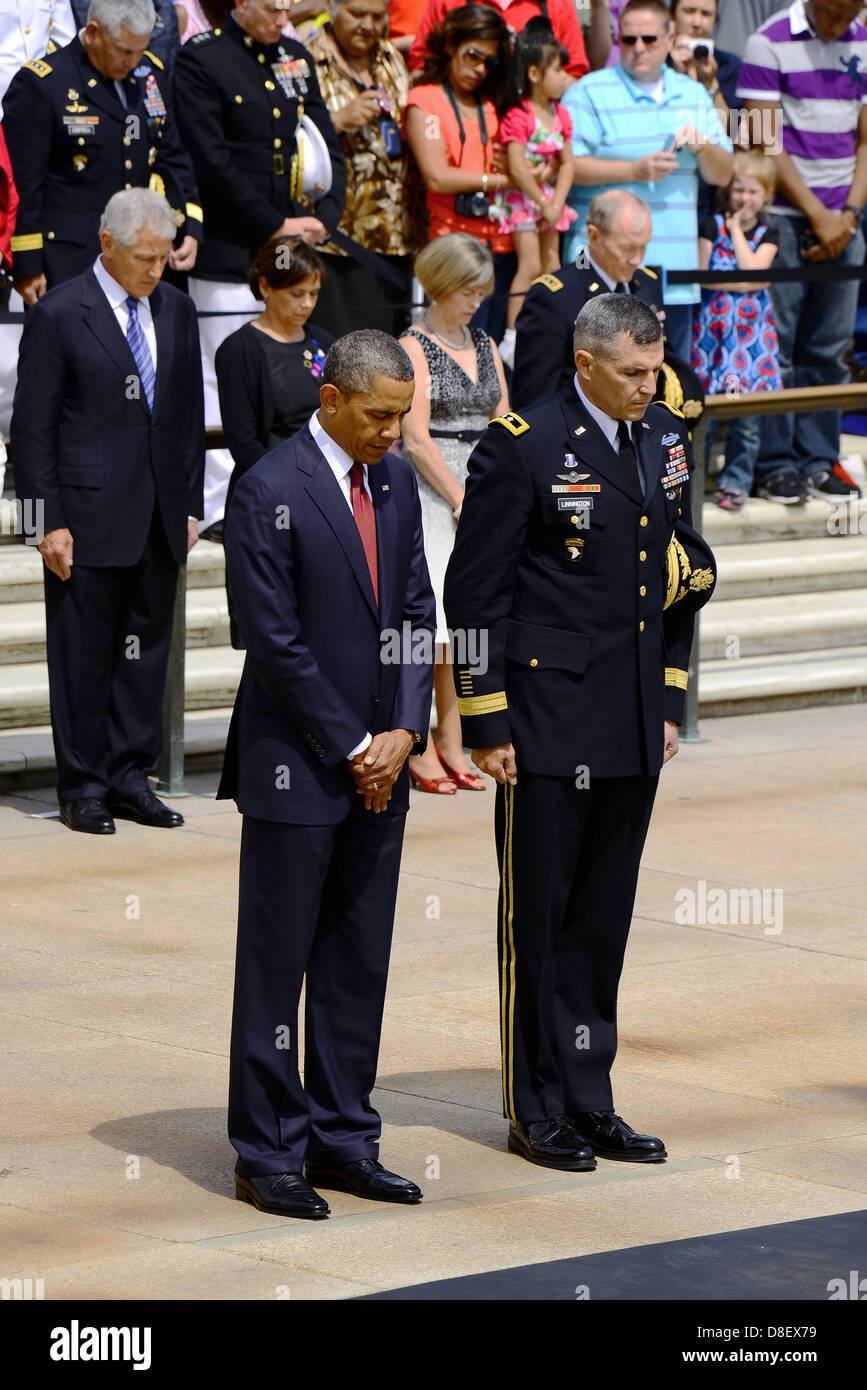 US President Barack Obama stands for a moment of silence with Maj. Gen. Michael S. Linnington during the Memorial Day wreath ceremony at the Tomb of the Unknown Soldier May 27, 2013 at Arlington National Cemetery, VA. Stock Photo
