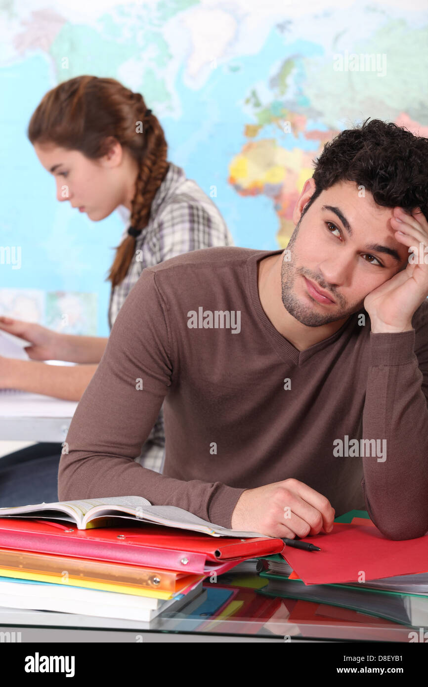 Bored student in classroom Stock Photo - Alamy
