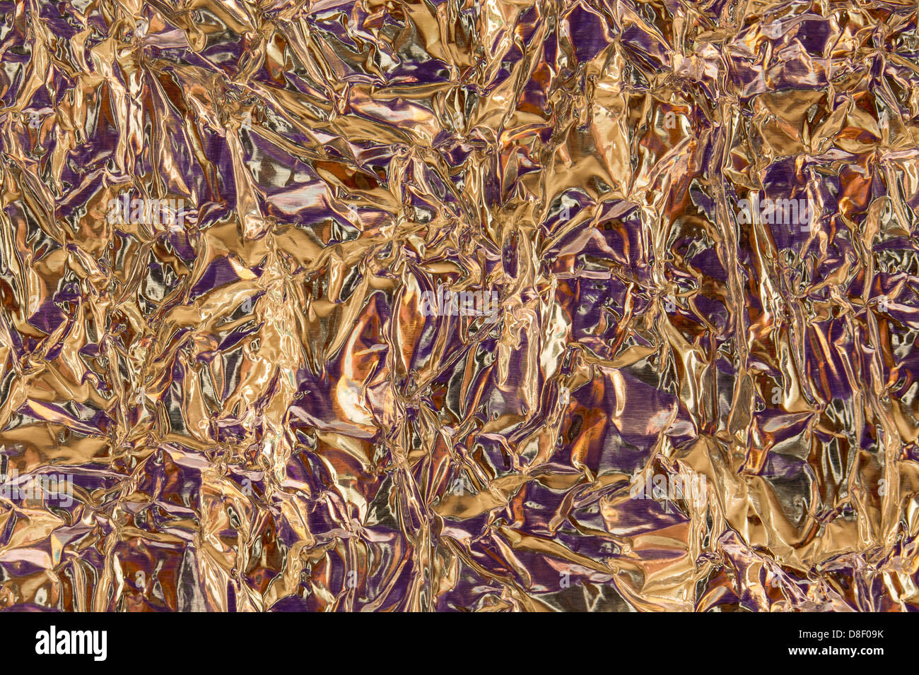 Crumpled Purple and Gold Tin Foil Texture Background Stock Photo