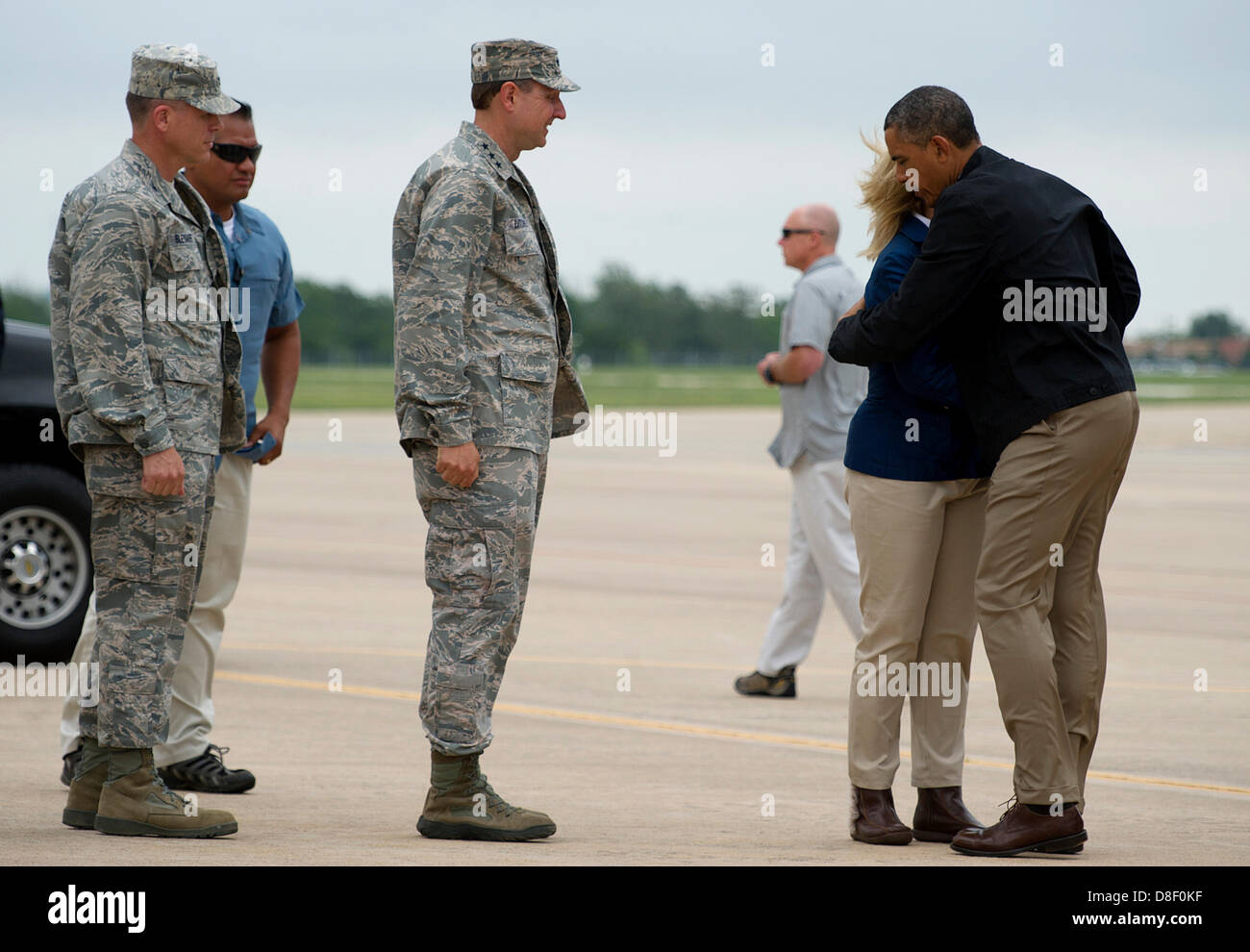 US President Barack Obama hugs Oklahoma Governor Mary Fallin at Tinker Air Force Base on his way to tour areas damaged by an EF5 tornado May 26, 2013 in Oklahoma City, OK. Stock Photo