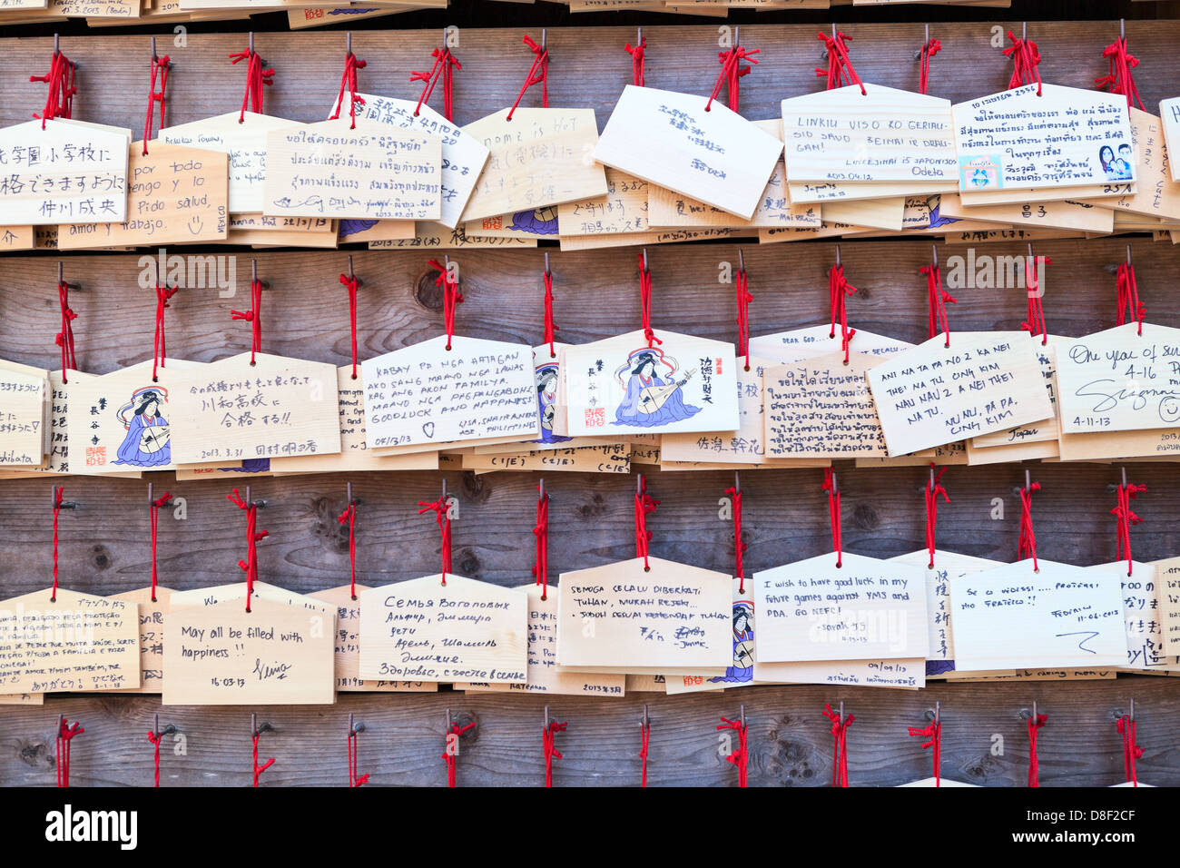 Ema background are small wooden plaques on which Shinto worshippers write their prayers or wishes. Kamakura, Japan Stock Photo