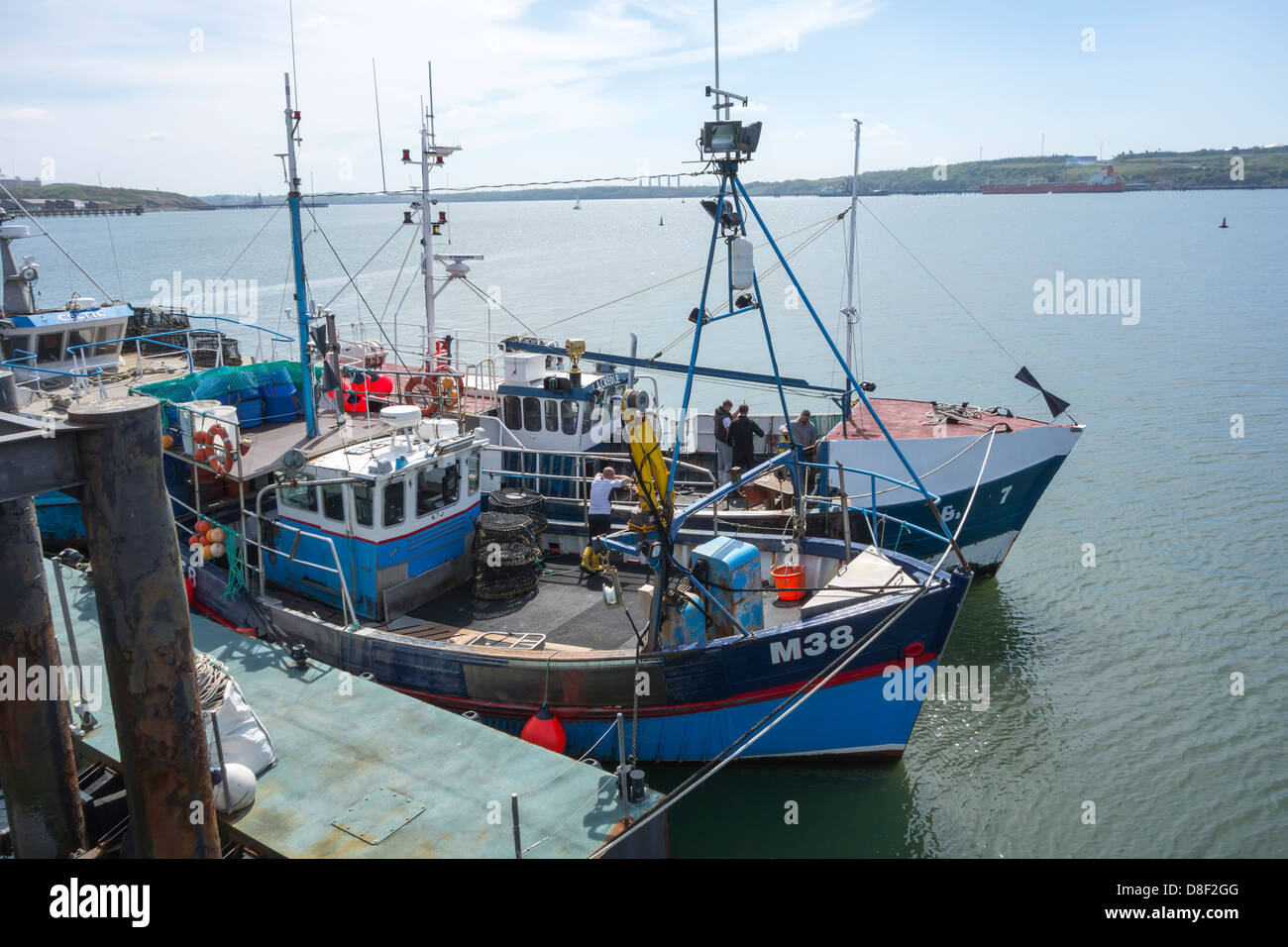 Fishing vessels moored outside the entrance to Milford Haven Port Stock Photo