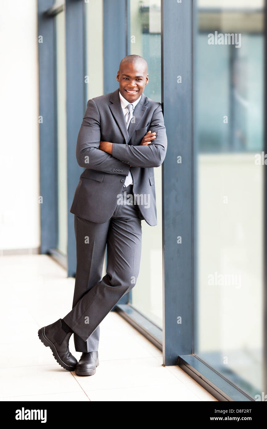 young african american businessman full length portrait in office Stock ...