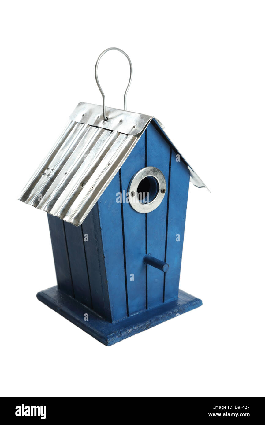 A close shot of a small, blue birdhouse isolated on a white background. Stock Photo