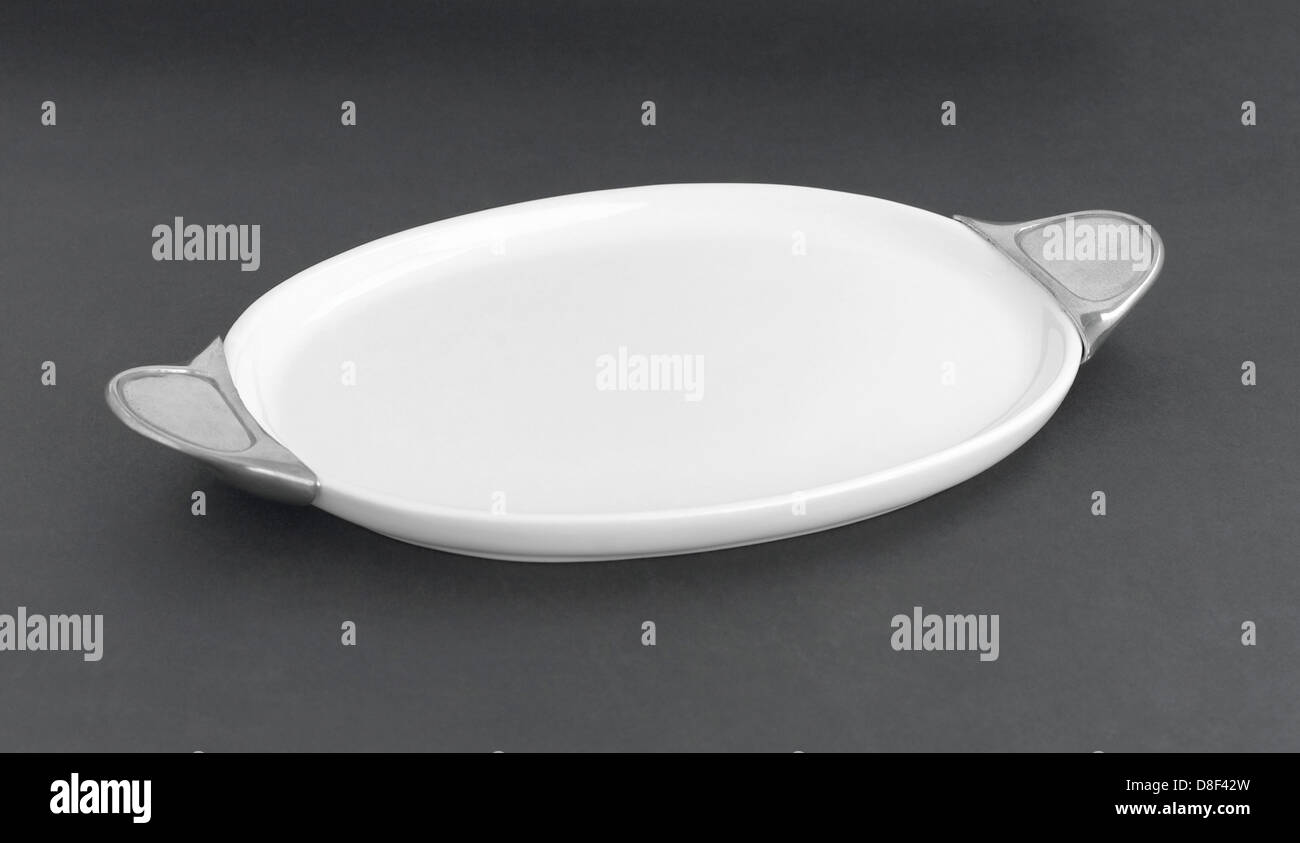 beautiful big tray for serving some food or snack with pewter handle Stock Photo
