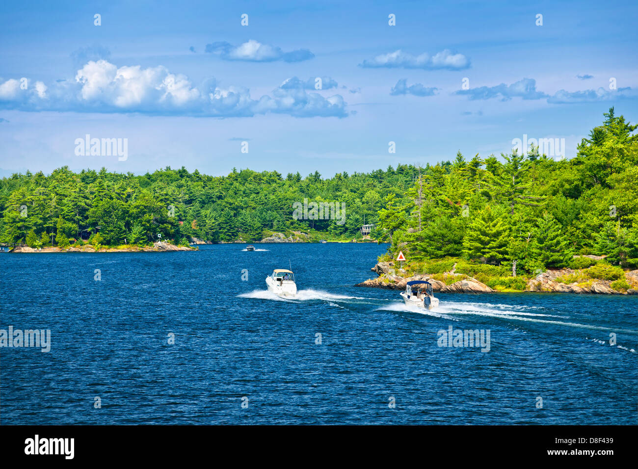 Recreational boats on blue waters of Georgian Bay near Parry Sound, Ontario Canada Stock Photo