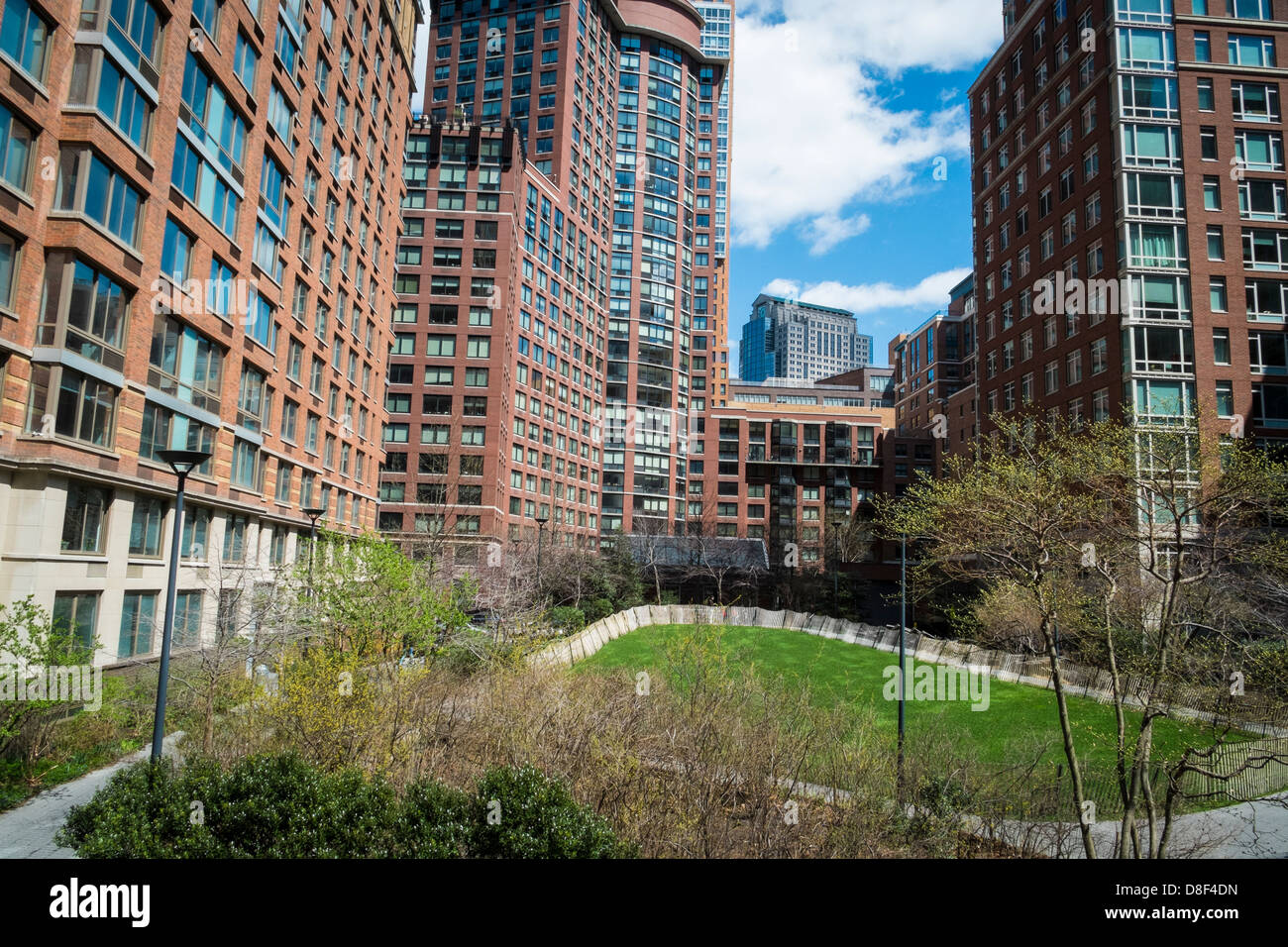 Image showcasing Modern apartments with natural landscaping of central lawn Stock Photo ...