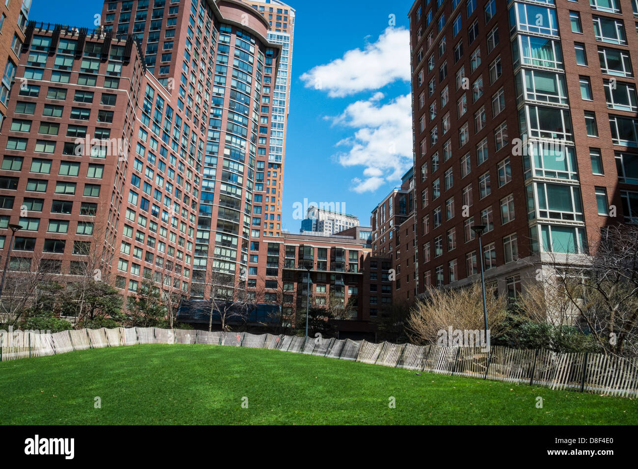 Picture of Modern apartments with natural landscaping of central lawn Stock Photo ...