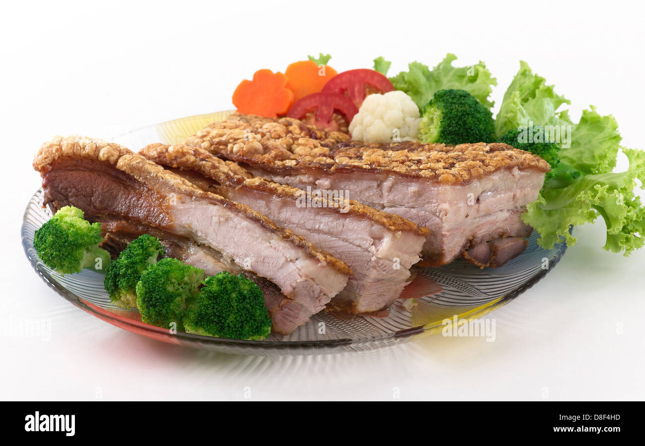 Fried crispy pork served with vegetable Stock Photo