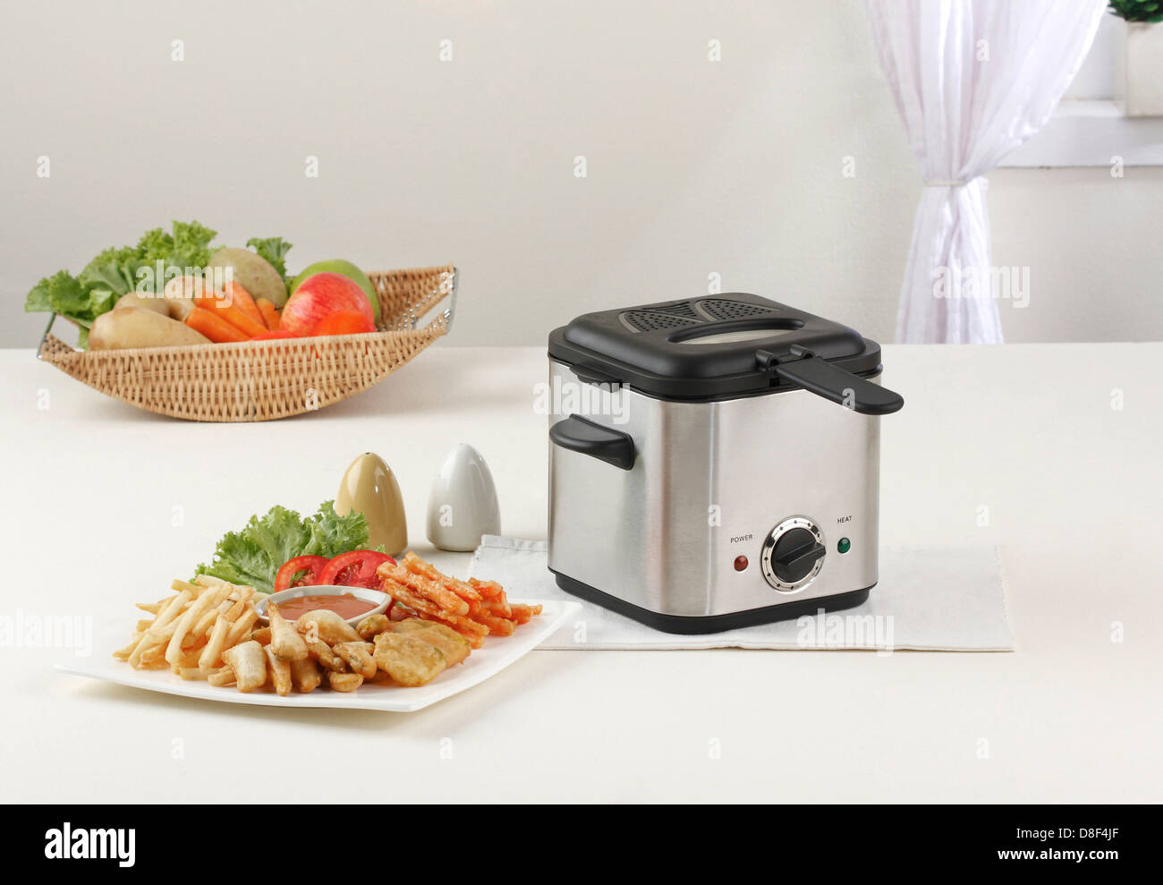 Let's do your French fry by using deep fryer machine comfortable and fast Stock Photo