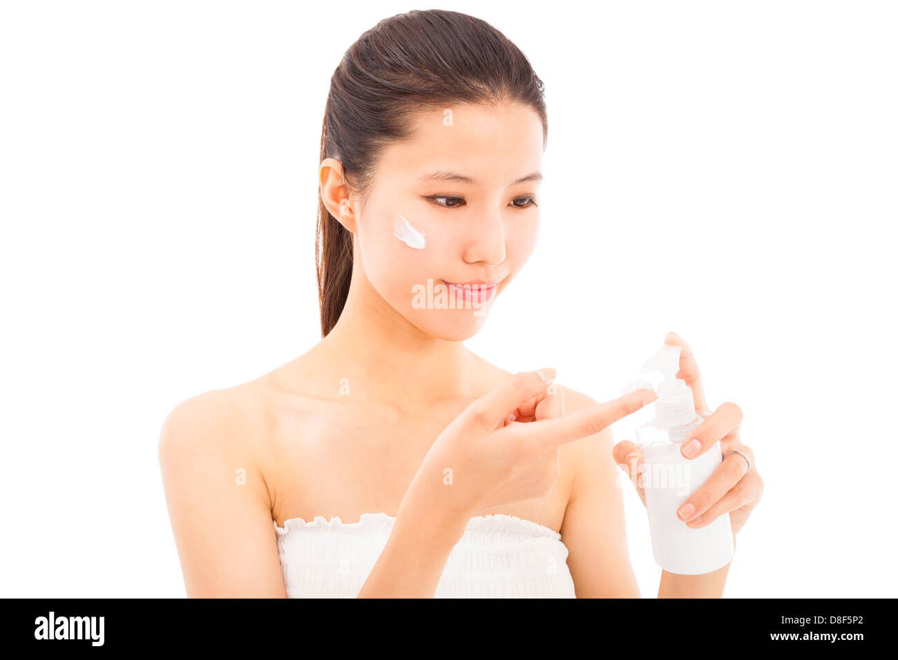 young beautiful face of woman applying moisturize cream Stock Photo