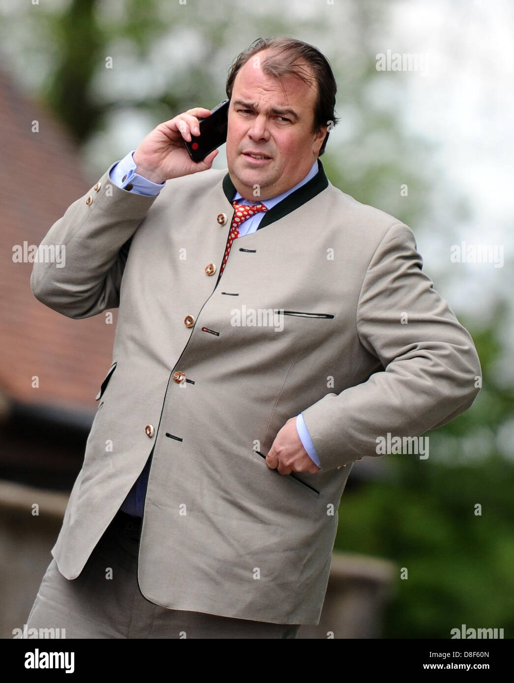 Lord of the castle in Langenburg, Prince Philipp of Hohenlohe-Langenburg, talks on a mobile phone in Langenburg, Germany, 27 May 2013. Prince Charles visited Baden-Wuerttemberg in order to attend a symposium on regional food production. Photo: DANIEL BOCKWOLDT Stock Photo