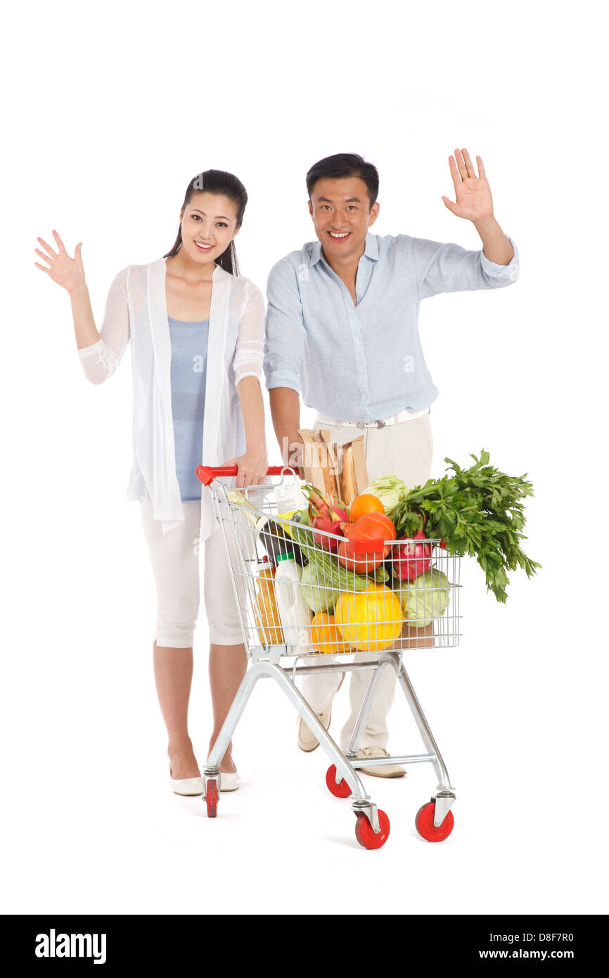 Young couple shopping with shopping cart Stock Photo