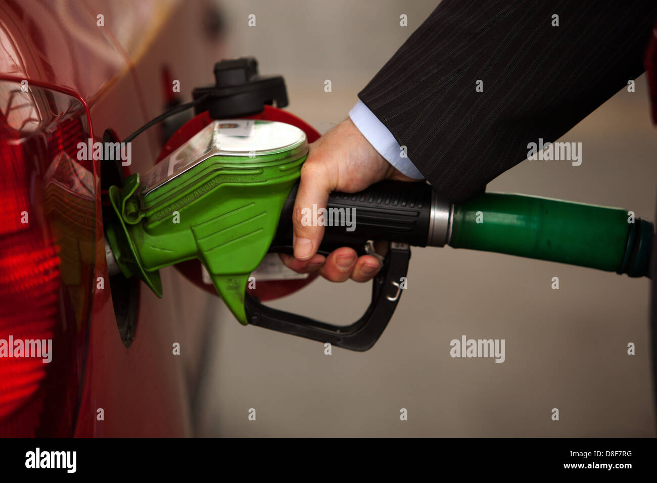 Refueling car at the petrol station fuel pump filler Stock Photo
