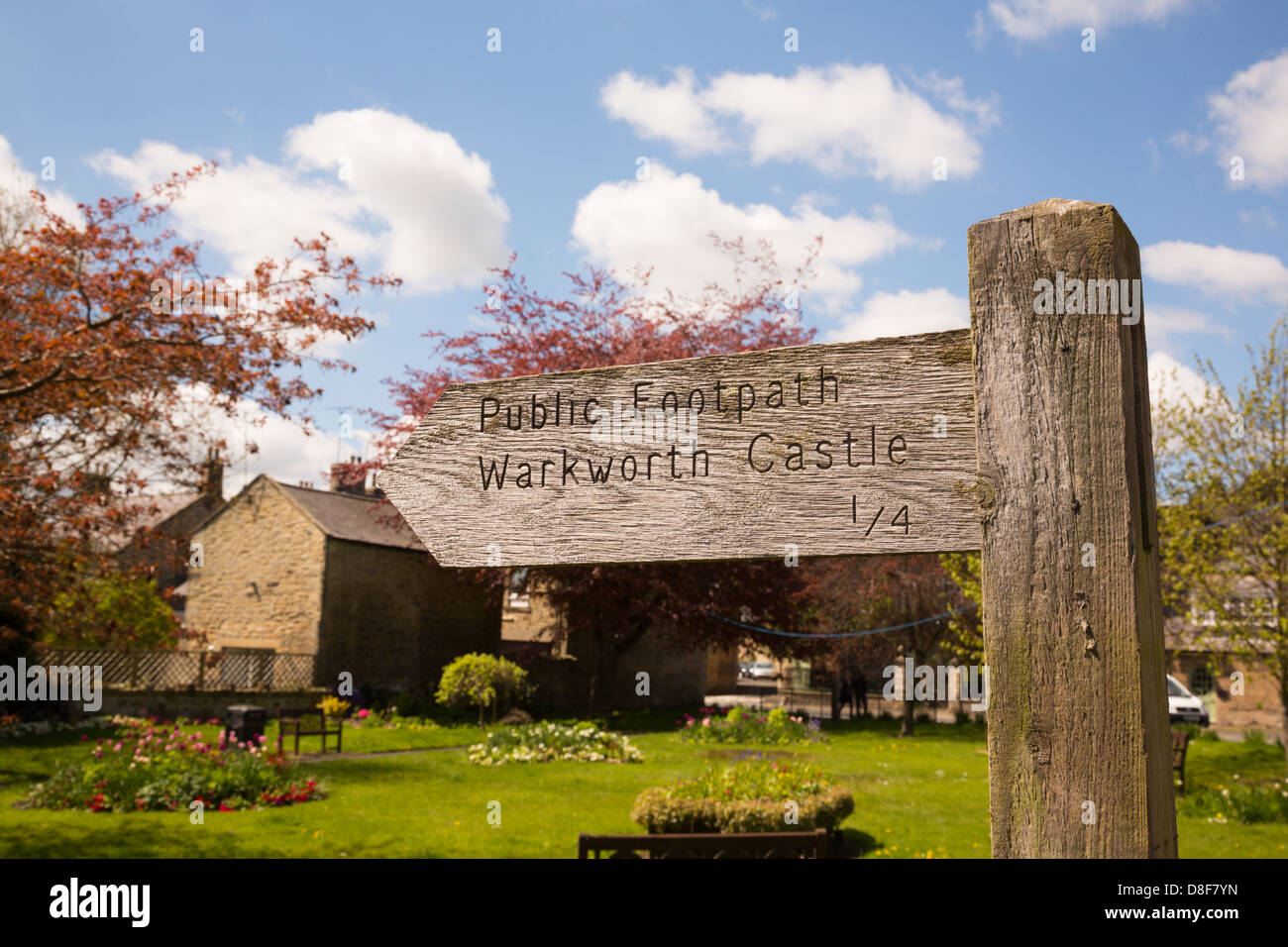 Wooden sign post to the castle, Warkworth, Northumberland Stock Photo ...
