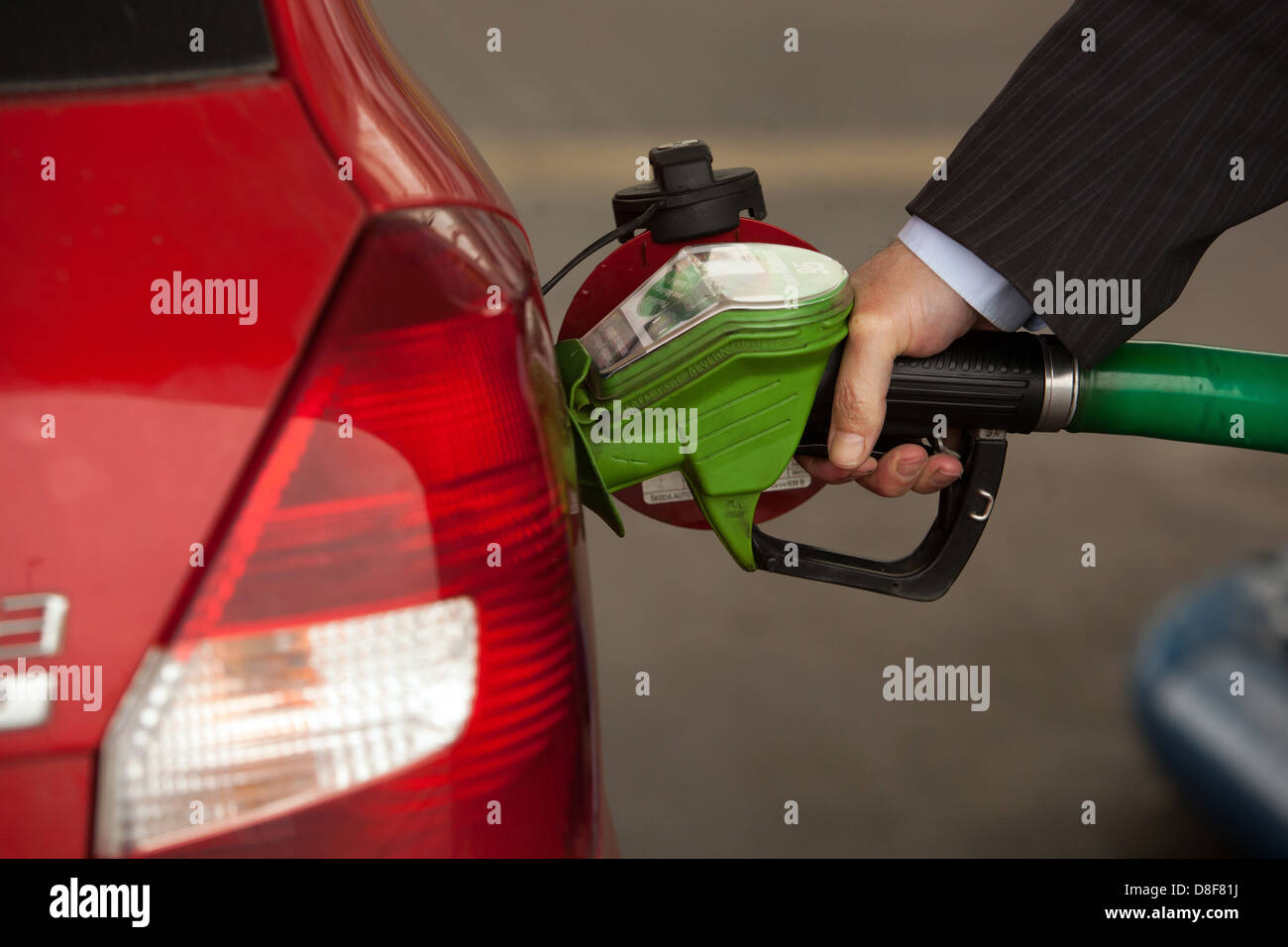 Refueling the car at the petrol station Man, Hand pumping, Fuel, Into, Car Stock Photo
