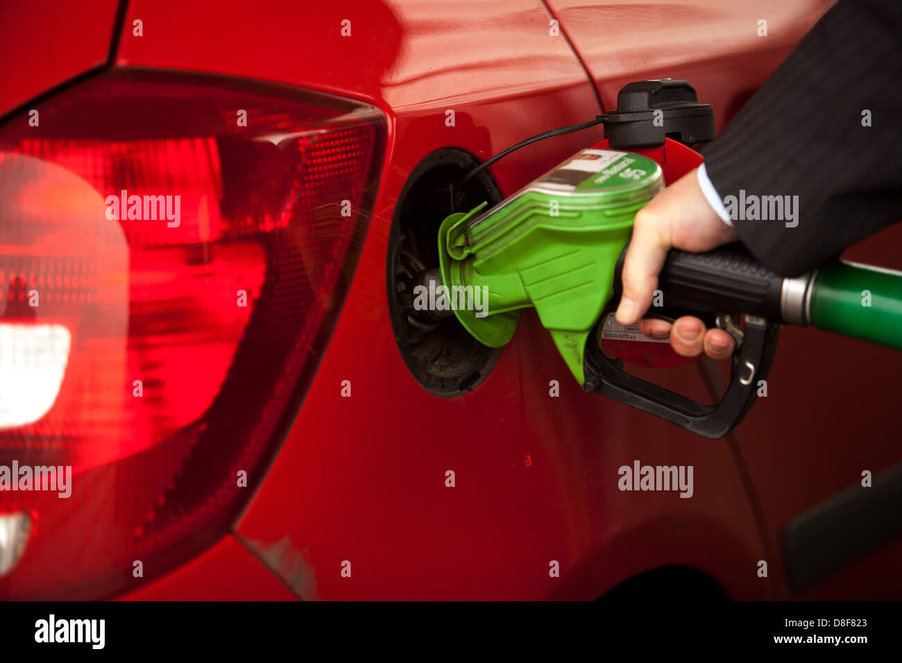 Refueling the car at the petrol station Man, Pumping, Gasoline Fuel, Filling Stock Photo