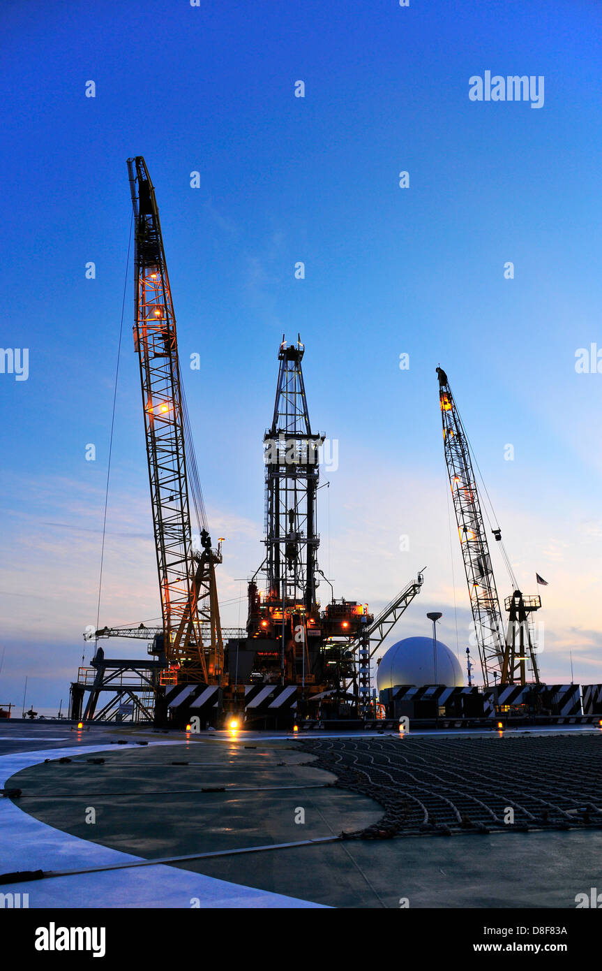 Oil rig platform at sunrise Stock Photo
