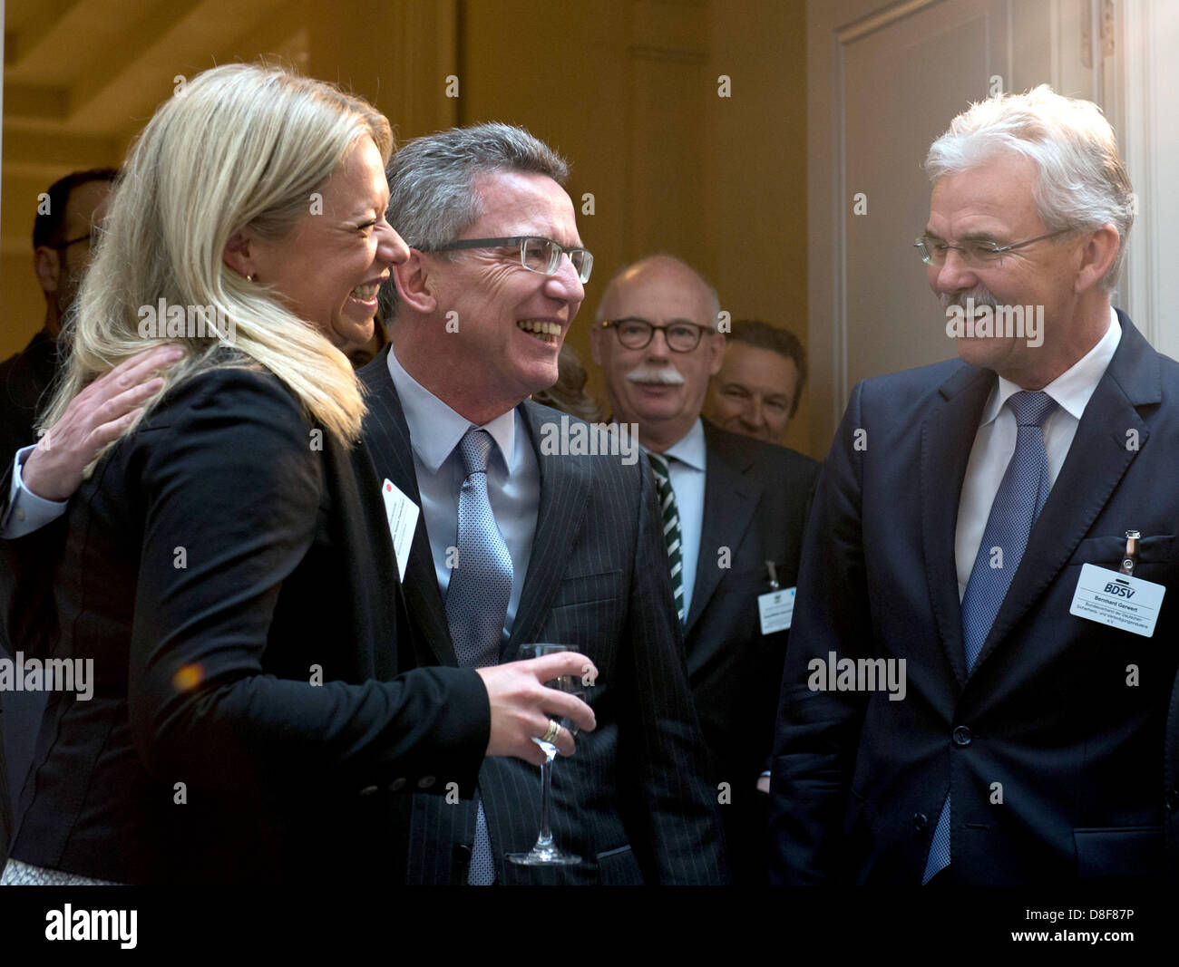 Geman Minister of Defence Thomas de Maiziere (CDU, C) and his Dutch colleague Jeanine Hennis-Plaschaert are welcomed by president of the German Association of the German Defence Industry, Bernhard Gerwert (R), before the start of the Berlin Strategy Conference in Berlin, Germany, 28 May 2013. Photo: SOEREN STACHE Stock Photo