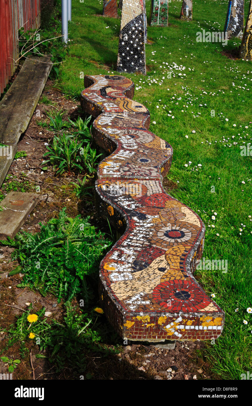 A seat in the style of a mosaic by the Wherryman's Way long distance path at Coldham Hall, Norfolk, England, United Kingdom. Stock Photo