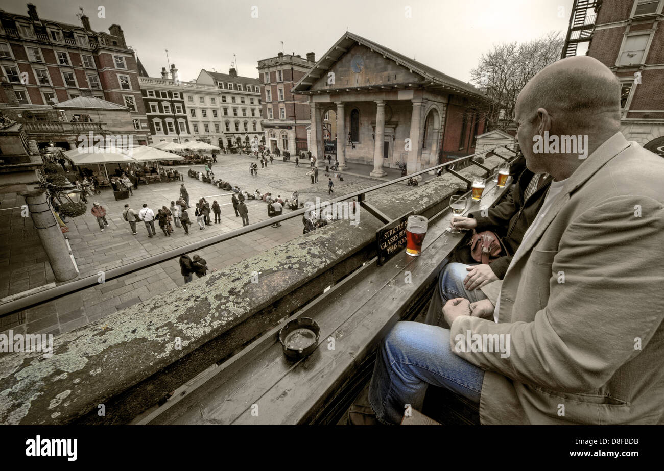 Drinking in the Punch & Judy, looking over Covent Garden London - Selective Colour Stock Photo
