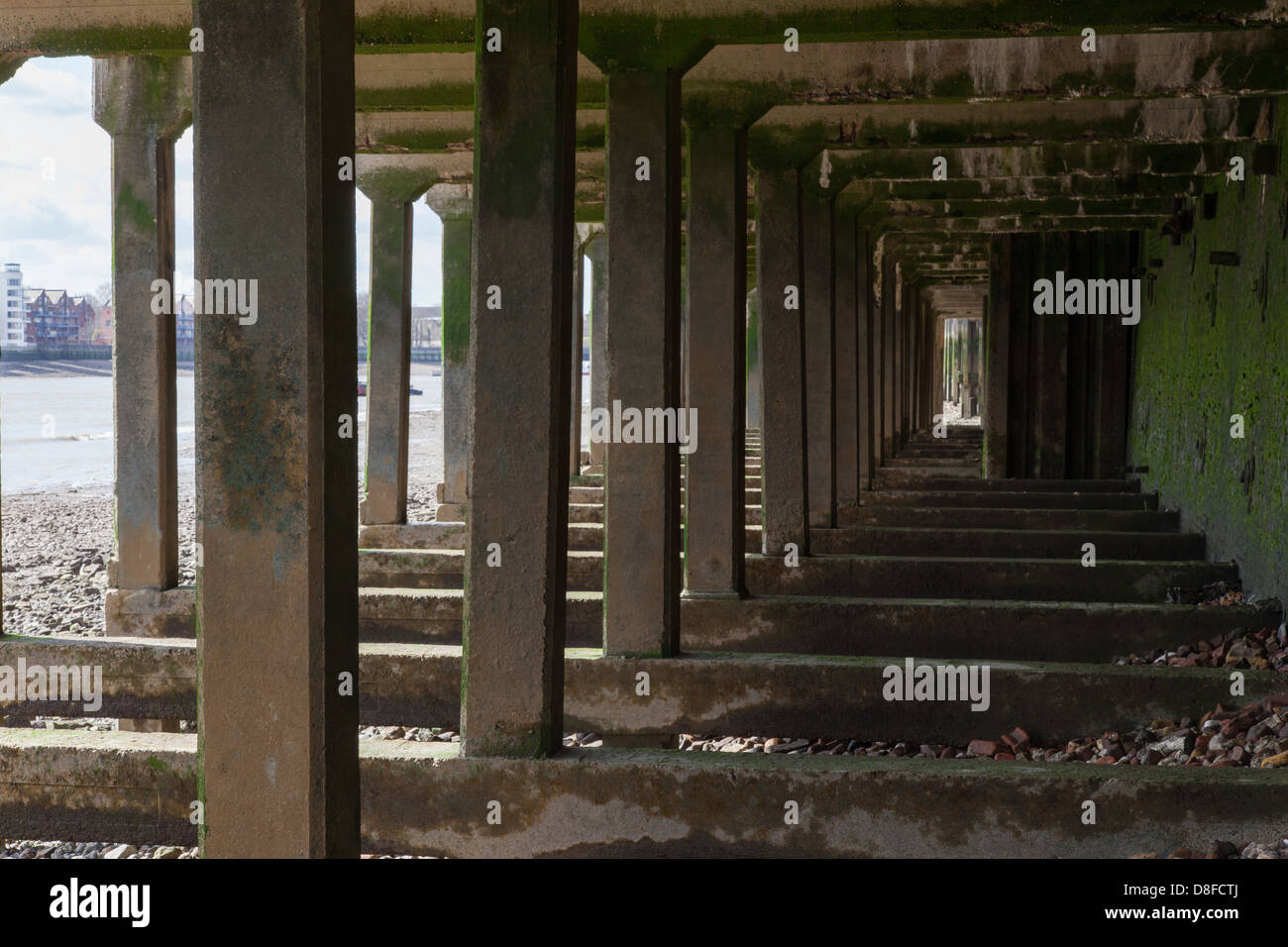 Supports underneath Thames pathway, foreshore, river Thames Stock Photo