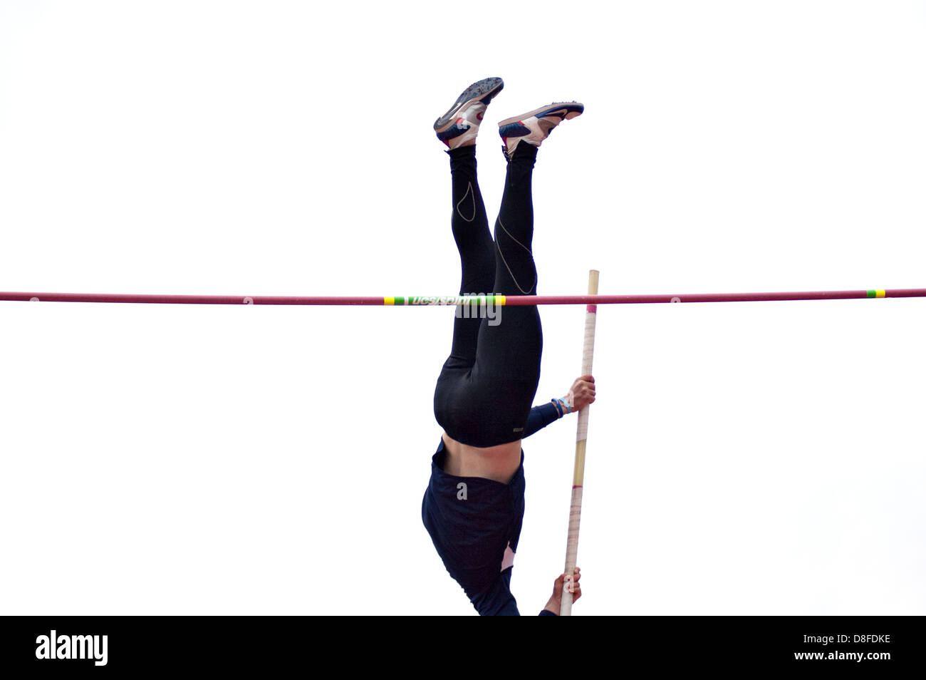 An athlete passes the bar in the pole vault Stock Photo Alamy