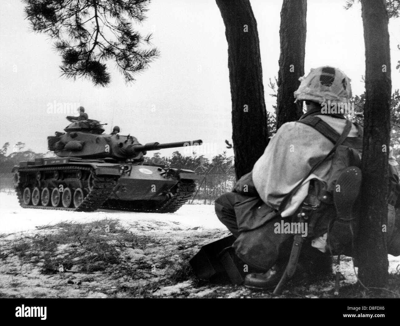 Infantry units and tanks of the US army participate in a manoeuvre in Grunewald in Berlin on the 23rd of January in 1964. Stock Photo