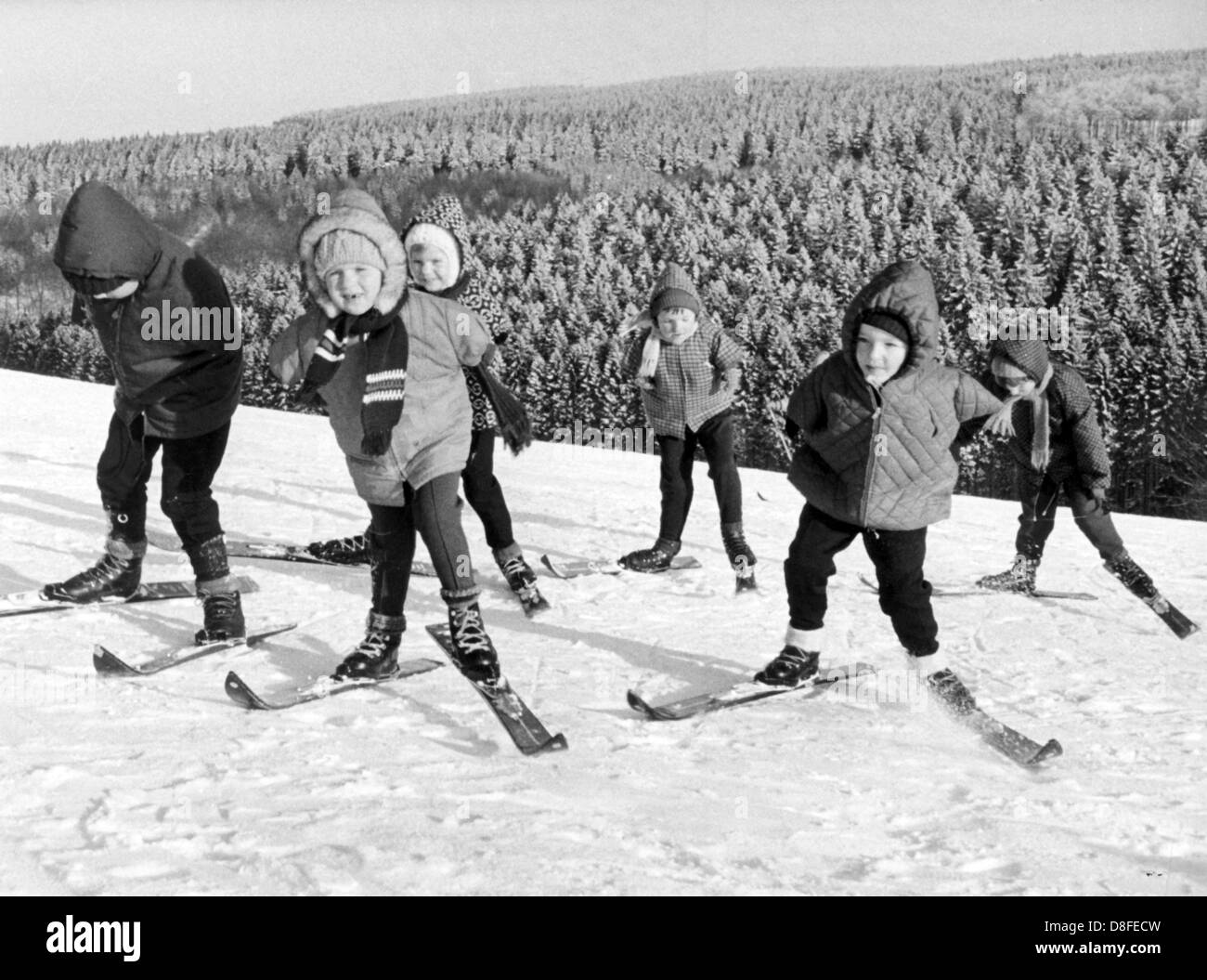 10 Contergan affected children from Iserlohn (Germany), learn how to ski in January 1968 in the Sauerland area in Germany. The experimental exercise, which is conducted by the Iserlohn Workers' Welfare Association at a children's home near Schürfelde (Meinertzhagen, Germany), aims to test new active exercise therapies. The school aged children are attended to by a physical therapist and a ski instructor. Stock Photo