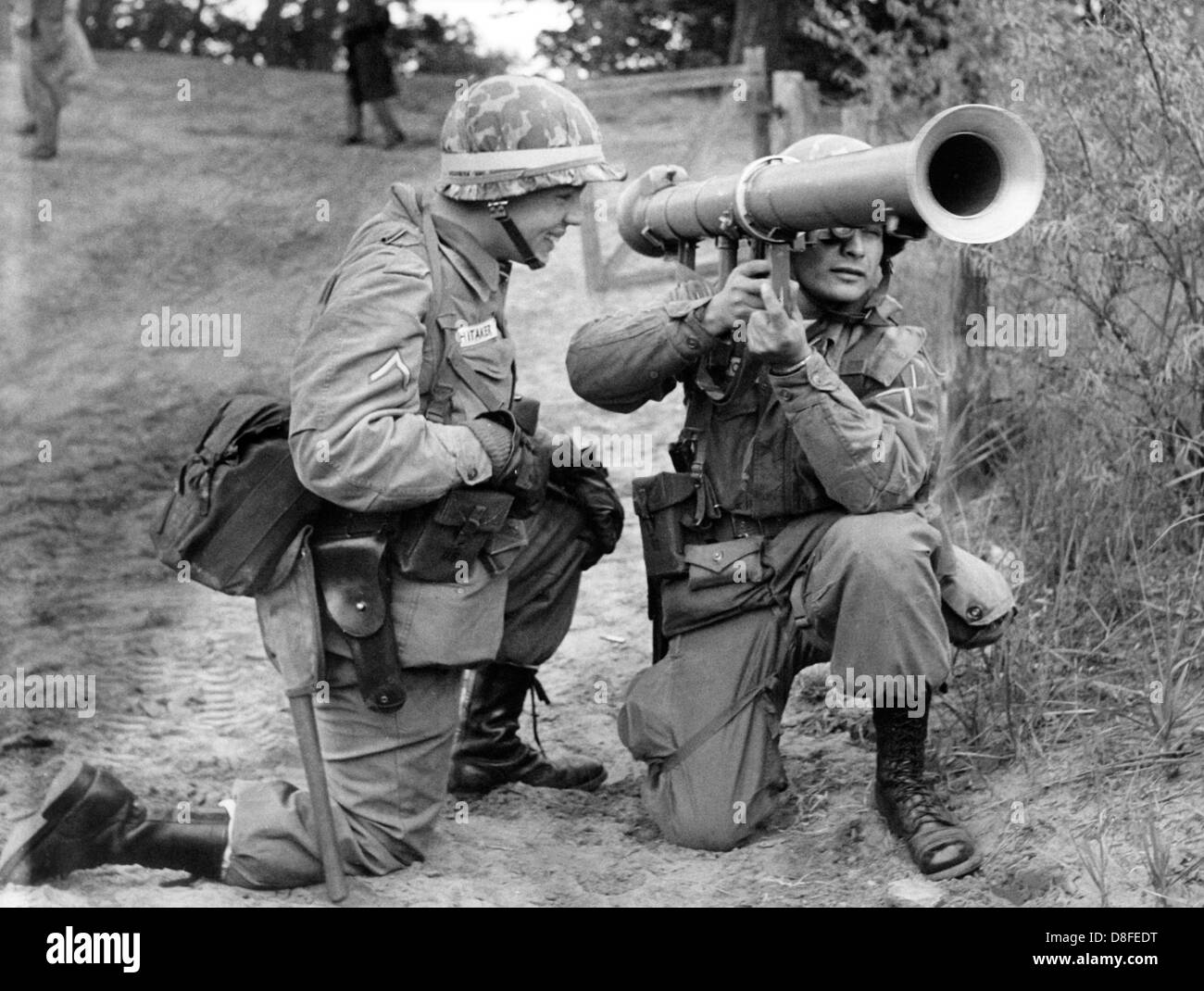 Two US soldiers practice the use of a bazooka during a field exercise ...