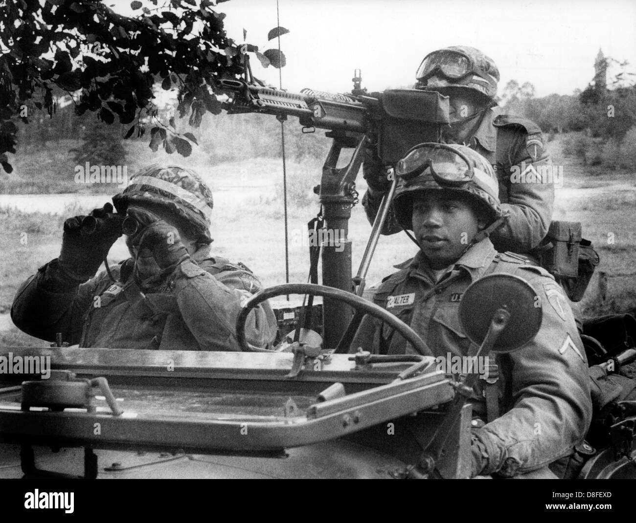 American soldiers of the US brigade Berlin sit in their jeep on the 18th of October in 1961 during a three day manoeuvre in Berlin Grunewald. Stock Photo