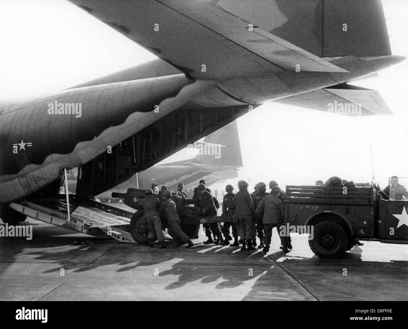 American soldiers load a Herkules transport machine during airborne manoeuvre 'South Arrow' at dawn on the 3rd of May in 1966. Stock Photo