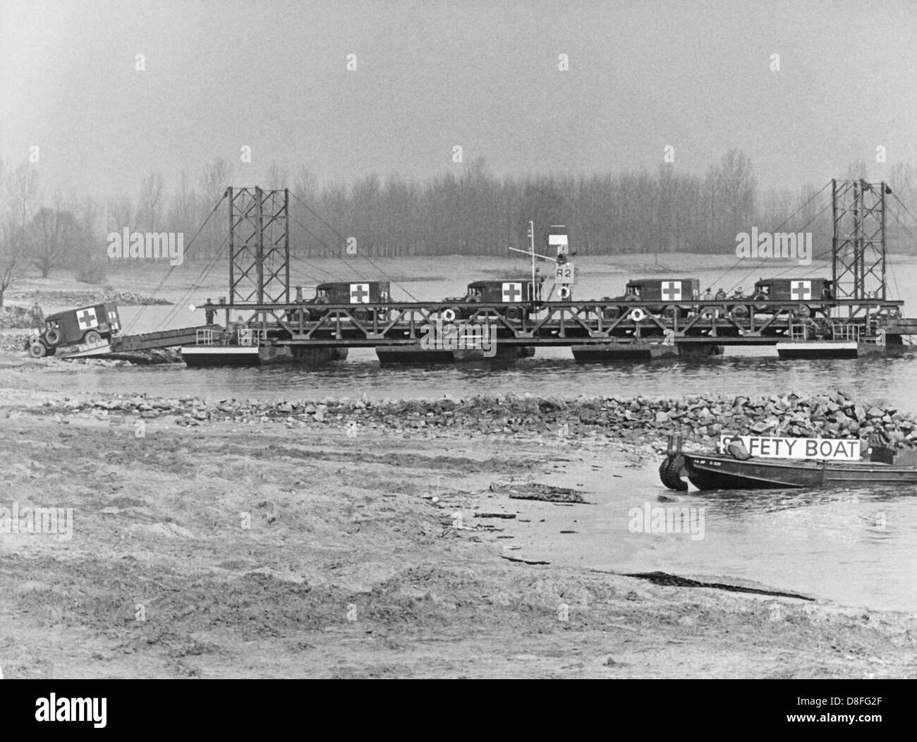 US army medical corps cross the river Rhine during a manoeuvre with a ferry near Guntersblum on the 21st of March in 1964. Stock Photo