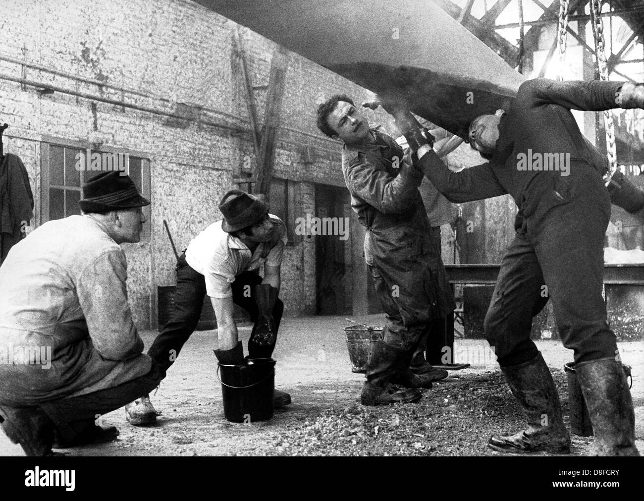 Gastarbeiter from Greece, Turkey and Spain work in a galvanization factory in Berlin in 1966. Stock Photo