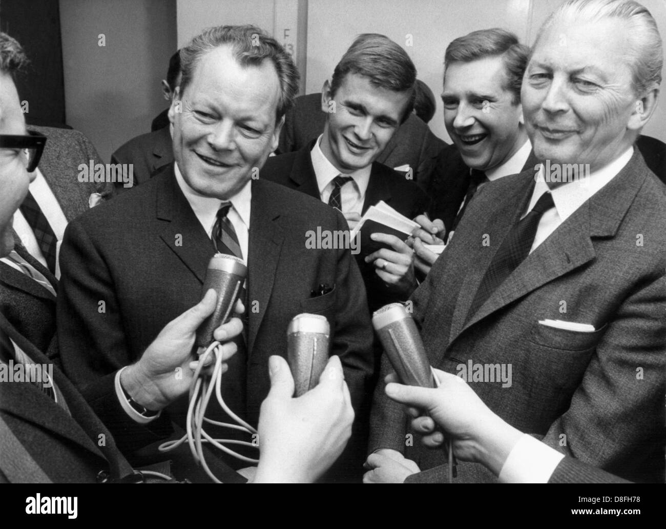 Chairman of the SPD Willy Brandt and chancellor candidate of the CDU Kurt Georg Kiesinger answer questions by journalists concerning their talks about a possible grand coalition on the 24th of November in 1966. The cabinet Kiesinger was sworn in on the 1st of December in 1966, consisting of a grand coalition of CDU/CSU and SPD. Stock Photo