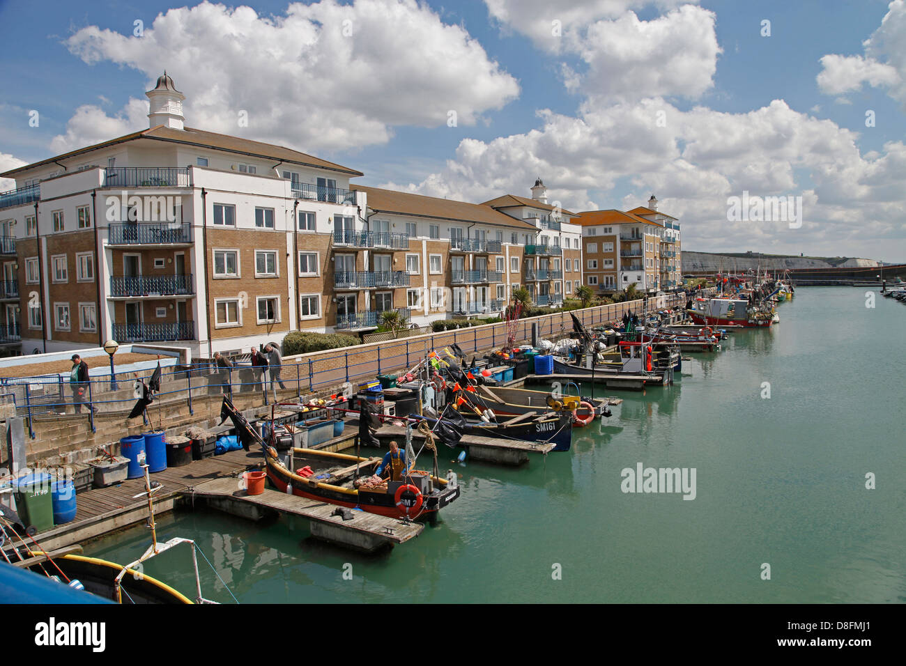 Fishing boats moored alongside the waterfront at Brighton Marina Stock