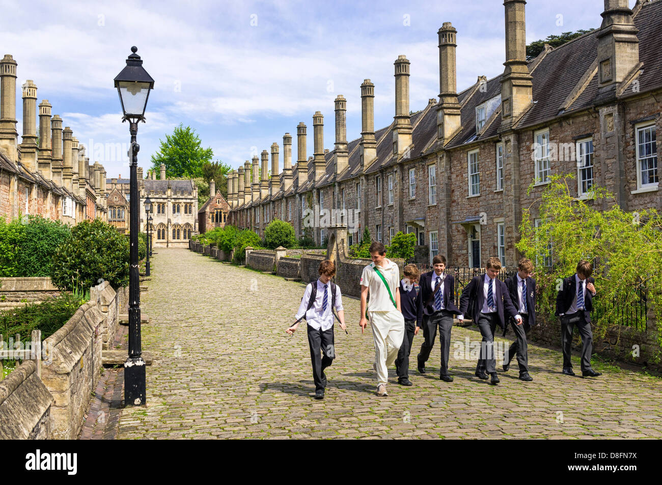 Boys from the Cathedral School in Wells, Somerset UK - people walking down Vicars Close Stock Photo