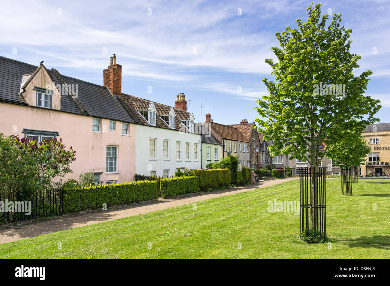 Row of old houses on the green in Wells, Somerset, England, UK Stock Photo
