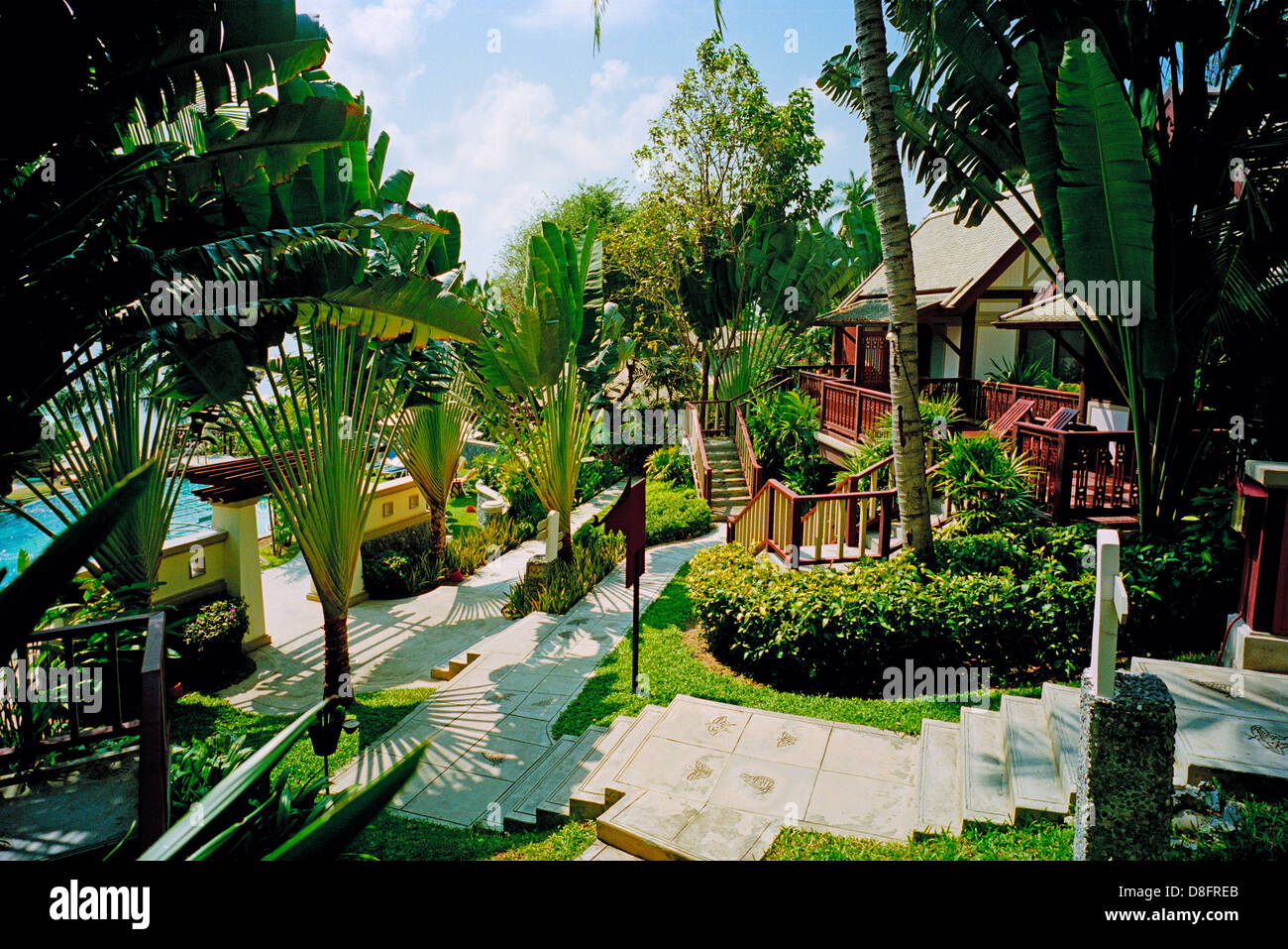 Hardwood chalets are a feature of this hotel, set on a tropical forested hillside sweeping down to the sea on Koh Samui Thailand Stock Photo