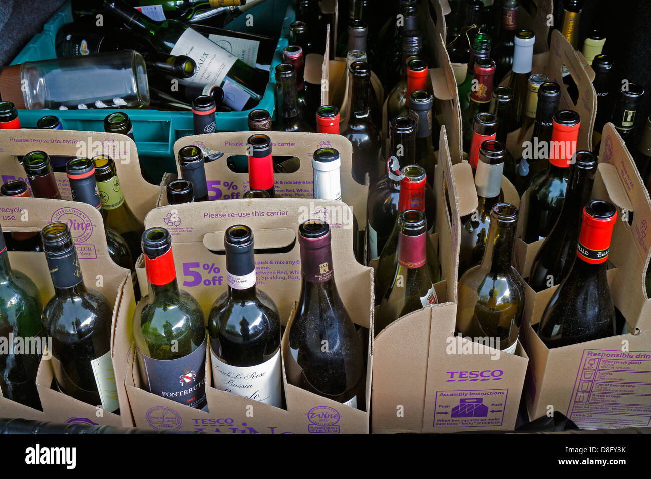 Empty wine bottles with labels, in card carriers, ready to be recycled. 131863 Wine Bottle. Stock Photo