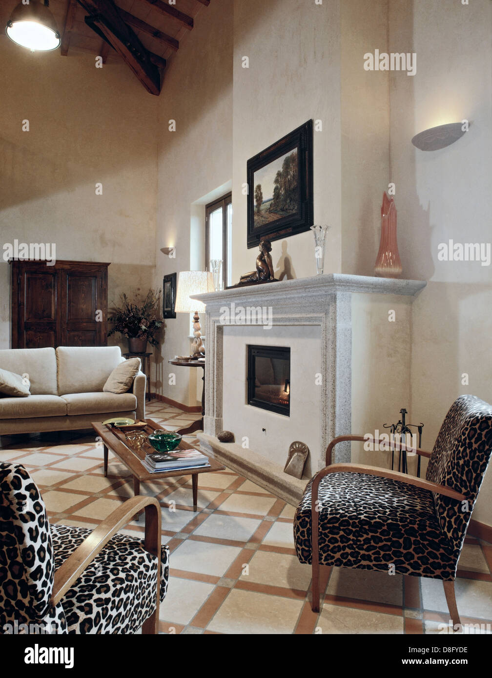 classic living room with fireplace and vintage armchairs Stock Photo ...